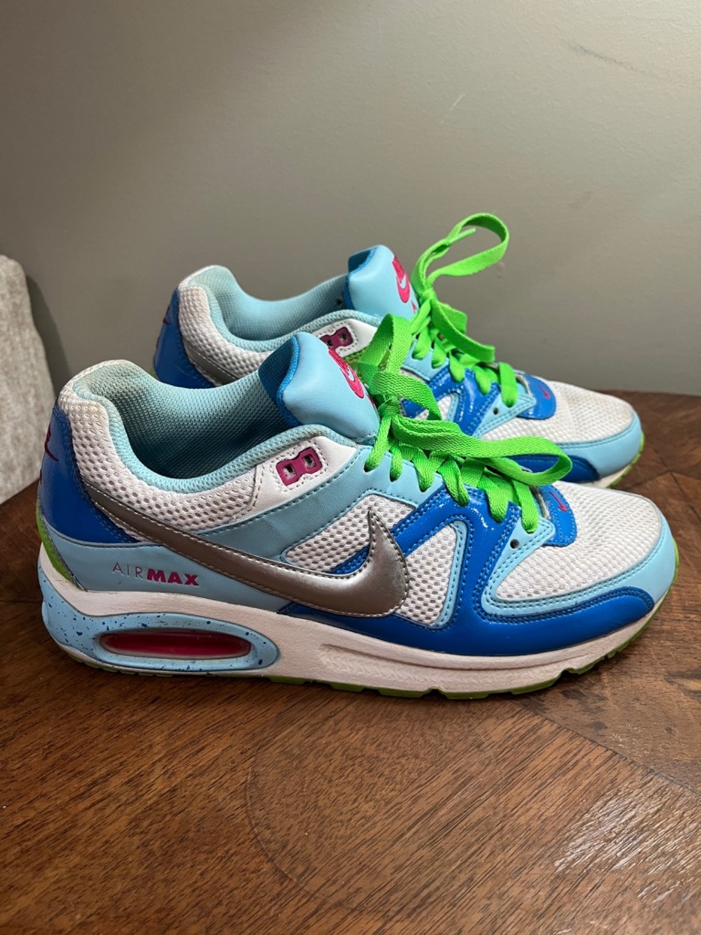 Nike Air Max Command sneakers in a vibrant blue, white, and lime green colorway.